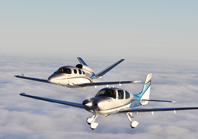 landing-page-aviation1 2 airplanes above the clouds